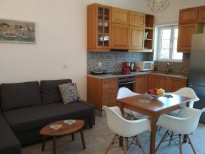 A kitchen or kitchenette at Theofilos apartment