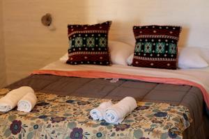 Un pat sau paturi într-o cameră la Hotel de Campo El Rebenque