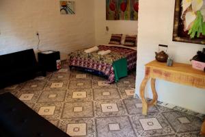 Una cama o camas en una habitación de Hotel de Campo El Rebenque