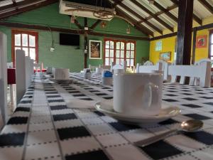 Un restaurant u otro lugar para comer en Hotel de Campo El Rebenque