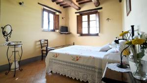 Ένα ή περισσότερα κρεβάτια σε δωμάτιο στο Le Terre Di Giano