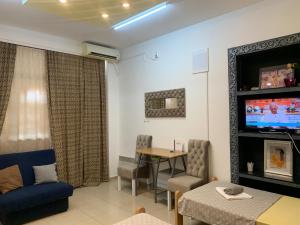 a living room with a couch and a table at Guesthouse Vladimir & Ana in Pančevo