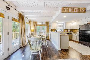 a kitchen with a table and chairs in it at Honey Bear Hideaway in Helen