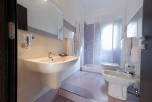 a bathroom with a sink and a toilet at 4Canti Case Vacanze in Castellammare del Golfo