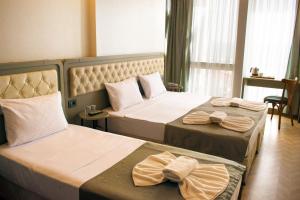 Postel nebo postele na pokoji v ubytování Mayer Hotel Istanbul + 37 fotografií
