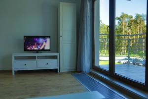 TV a/nebo společenská místnost v ubytování Baltic Sea Apartment
