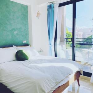 En eller flere senge i et værelse på 洄來寮包棟民宿