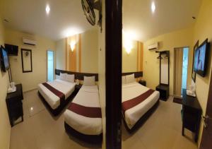 Sun Inns D'mind 3 Seri Kembangan客房内的一张或多张床位