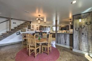 a kitchen and dining room with a wooden table and chairs at Montrose Barndominium on 7 Acres with Views! in Montrose