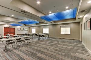 a conference room with tables and chairs and blue lights at Holiday Inn Express Hotel and Suites Weatherford, an IHG Hotel in Weatherford