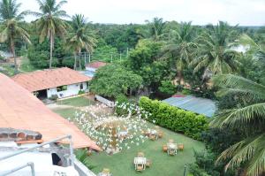 an overhead view of a garden with tables and chairs at Seed Resort in Shrīrangapattana