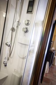 a shower stall with a toilet in a bathroom at Locanda Dei Baroni in Vasto