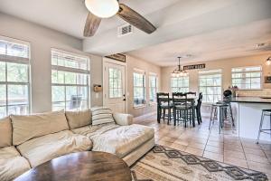 a living room with a couch and a table at Stylish Grand Lake Retreat with Fishing Dock! in Eucha