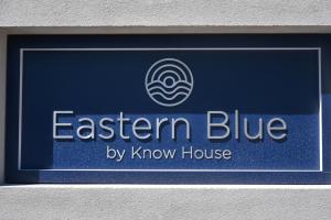 a sign for an eastern blue by kknow house at Eastern Blue - Sea View Luxury Apartment in Poste Lafayette