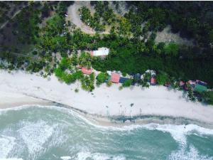 an aerial view of a beach with the ocean at Cabaña The Sunset in Santa Marta