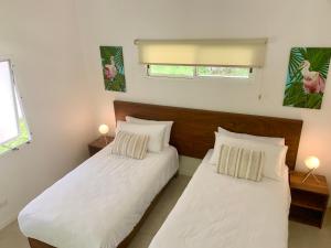 Rúm í herbergi á Aves Hotel Montezuma