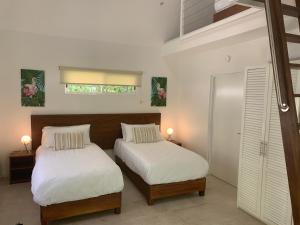 Rúm í herbergi á Aves Hotel Montezuma