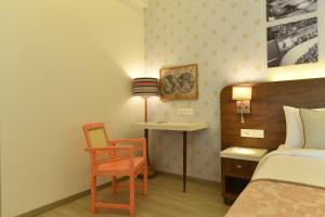 Cama ou camas em um quarto em The Avatar Hotel & Convention