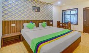 Postel nebo postele na pokoji v ubytování Itsy Hotels Igloo Residency Raja Seat
