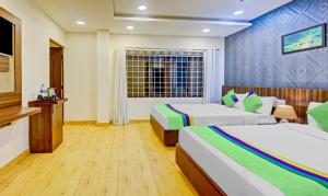Postel nebo postele na pokoji v ubytování Itsy Hotels Igloo Residency Raja Seat