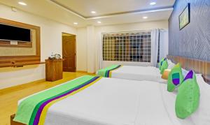 TV a/nebo společenská místnost v ubytování Itsy Hotels Igloo Residency Raja Seat
