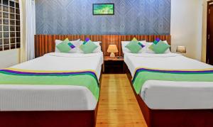 Postel nebo postele na pokoji v ubytování Itsy Hotels Igloo Residency Raja Seat