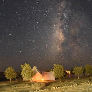 a night view of the milky way over a building at Skyline eco-camp in Mitzpe Ramon