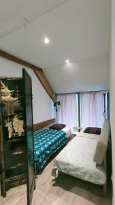 Postel nebo postele na pokoji v ubytování Domaine Ravy-La Camélia