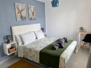 Łóżko lub łóżka w pokoju w obiekcie Oasis View Lanzarote