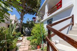 a house with a wooden fence and a stairway at Cozy House with Shared Pools near Beach in Bodrum in Giriş