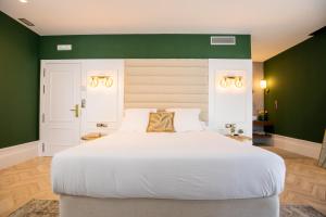 Un pat sau paturi într-o cameră la Casa do Estanco