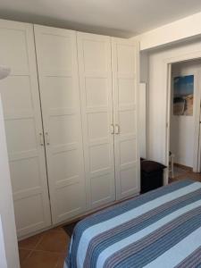 Postel nebo postele na pokoji v ubytování Casa Celeste Fregene, il mare di Roma