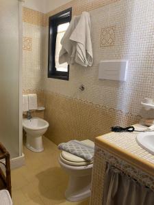 Koupelna v ubytování Villa Misangi