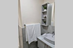 a bathroom with a sink and a mirror at Koena Court Apartment 3 - With Uncapped Fiber Wi-Fi in Midrand