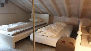 A bed or beds in a room at Charming Swiss Chalet Andermatt