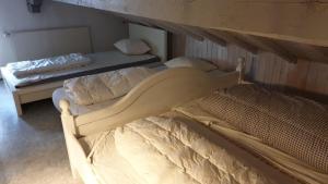 A bed or beds in a room at Charming Swiss Chalet Andermatt