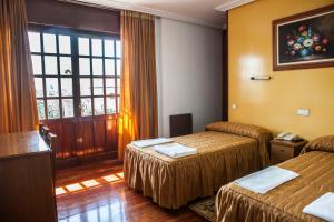 Cama o camas de una habitación en Hotel Antoyana