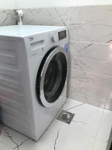 a washing machine is sitting in a bathroom at Centar Bruno in Novi Pazar