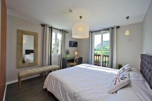 Letto o letti in una camera di Hotel Agian - Maison Bonnet