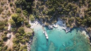 an aerial view of a beach with a boat in the water at B&B Margherita in Marina di Camerota
