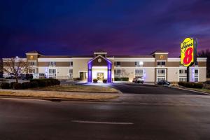 a large building with a sign in front of it at Super 8 by Wyndham Wichita East in Wichita