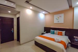 Кровать или кровати в номере Sans Hotel Nagari Malioboro