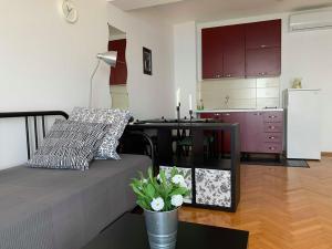 a living room with a bed and a kitchen at BEACH SEA VIEW APPARTMENT in Podgora +9 photos