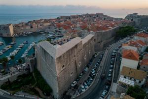 an aerial view of a city with boats in a harbor at Villa Ragusa Vecchia in Dubrovnik