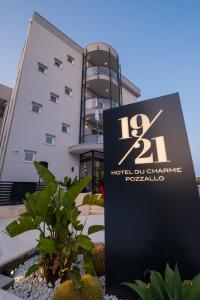 a sign in front of a building at Hotel 1921 in Pozzallo