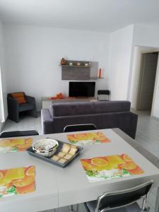 a living room with a table and a couch at Canada in Stresa