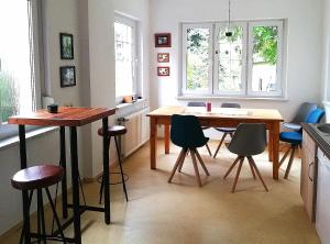 a kitchen with a table and chairs in a kitchen at Goethestraße 9 in Ballenstedt