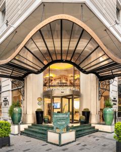 a store front of a building with a sign in front at Occidental Taksim in Istanbul