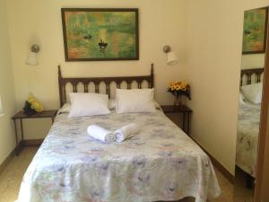 Postel nebo postele na pokoji v ubytování Hotel Comodoro