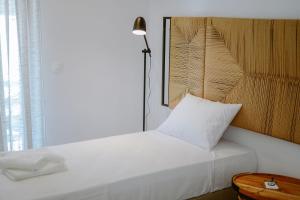Postel nebo postele na pokoji v ubytování Ardilia Cosy Apartment